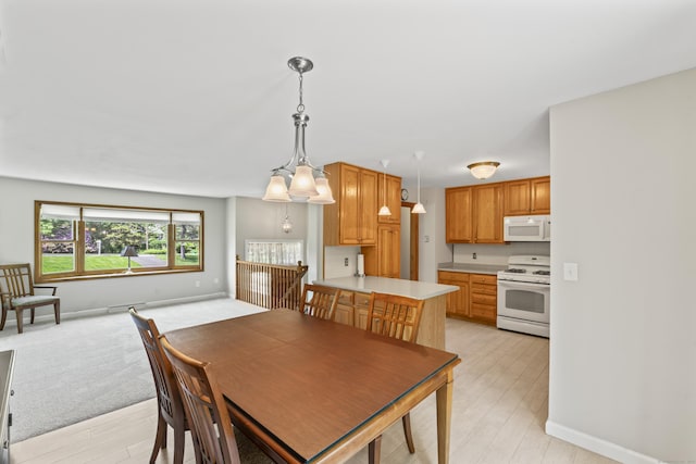 5 Settlers Ln, Newtown, CT 06482 - dining area with light wood-style floors and baseboards