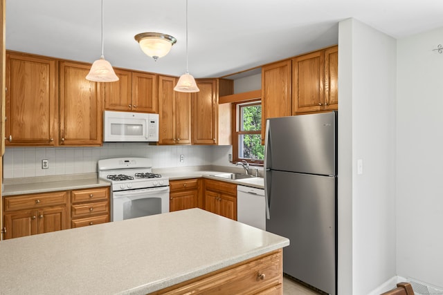 5 Settlers Ln, Newtown, CT 06482 - kitchen with white appliances, light countertops, backsplash, and a sink