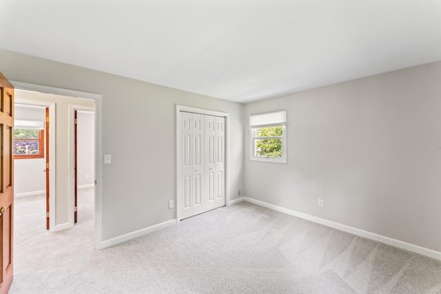 5 Settlers Ln, Newtown, CT 06482 - unfurnished bedroom featuring light colored carpet, baseboards, and a closet