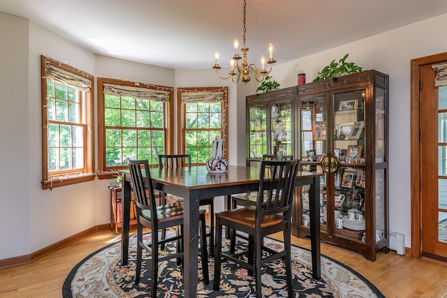 16 Botsford Rd, Kent, CT 06757 - dining area with light wood-style floors, a chandelier, and baseboards