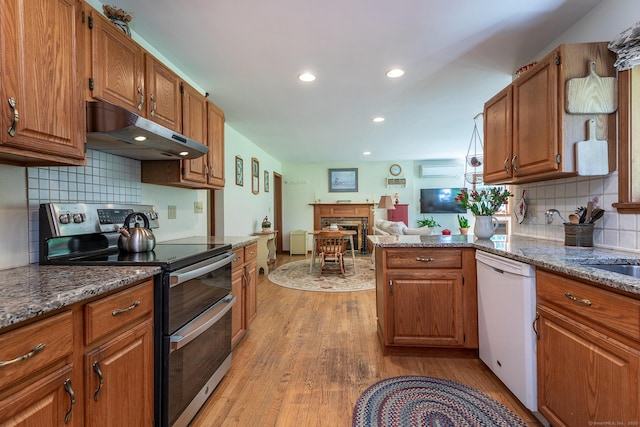 16 Botsford Rd, Kent, CT 06757 - kitchen featuring double oven range, under cabinet range hood, dishwasher, a fireplace, and light wood finished floors