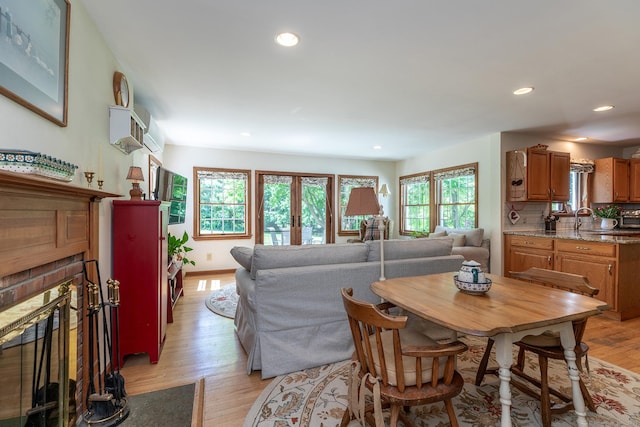 16 Botsford Rd, Kent, CT 06757 - dining space featuring light wood finished floors, recessed lighting, a fireplace, baseboards, and french doors