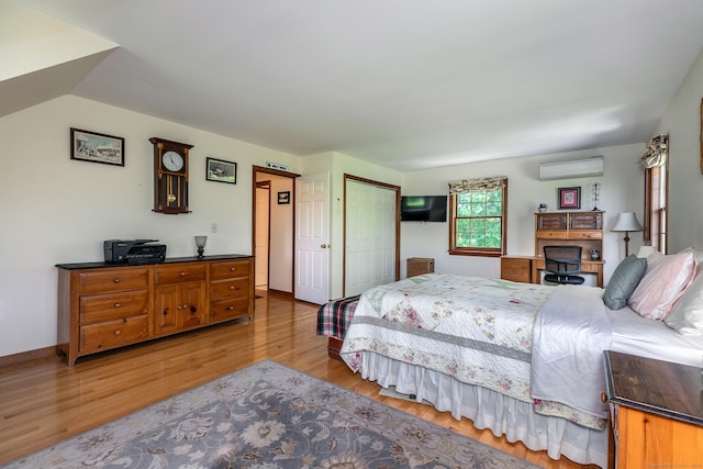 16 Botsford Rd, Kent, CT 06757 - bedroom featuring a wall mounted AC, light wood-style flooring, a closet, and baseboards
