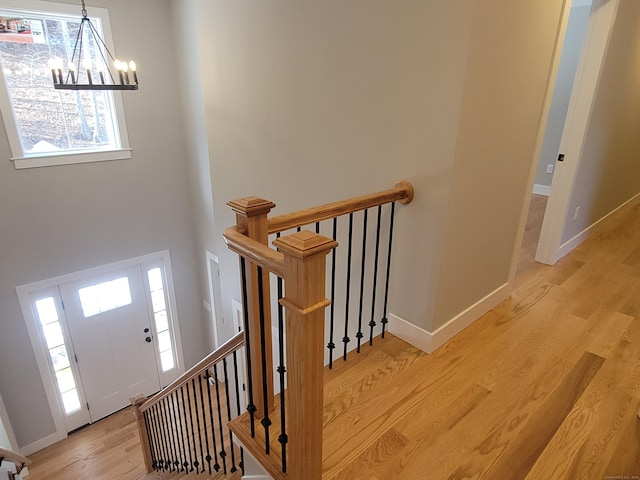82 Ladd Rd, Tolland, CT 06084 - entrance foyer featuring a chandelier, light wood-style flooring, and a high ceiling