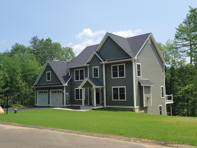 82 Ladd Rd, Tolland, CT 06084 - view of front of home featuring a front yard, driveway, an attached garage, and a shingled roof