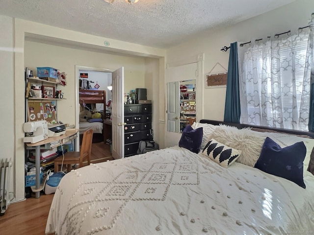 1 N Taylor Ave, Norwalk, CT 06854 - bedroom with wood finished floors and a textured ceiling