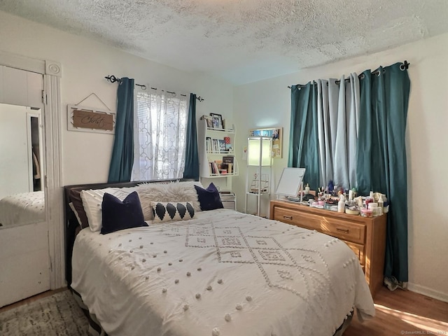 1 N Taylor Ave, Norwalk, CT 06854 - bedroom with wood finished floors and a textured ceiling