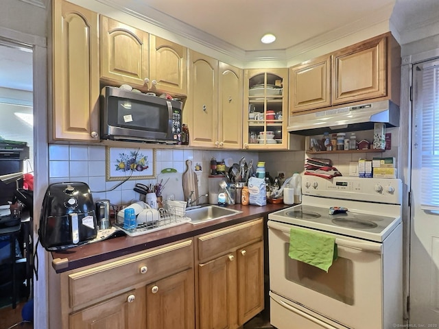 1 N Taylor Ave, Norwalk, CT 06854 - kitchen with white electric range oven, stainless steel microwave, under cabinet range hood, tasteful backsplash, and dark countertops