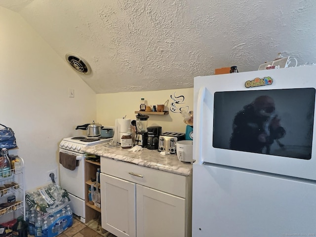 1 N Taylor Ave, Norwalk, CT 06854 - kitchen featuring white appliances, lofted ceiling, white cabinets, light countertops, and a textured ceiling
