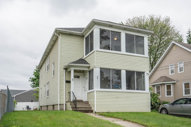 5 Seymour Ave, West Hartford, CT 06119 - view of front facade featuring entry steps, a sunroom, and a front yard