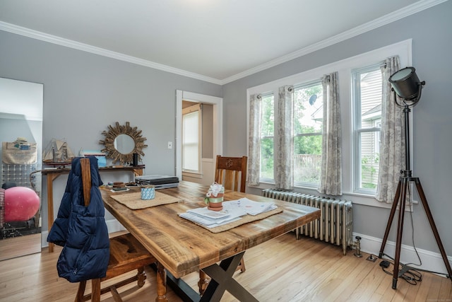 5 Seymour Ave, West Hartford, CT 06119 - dining space featuring radiator, crown molding, light wood finished floors, and baseboards