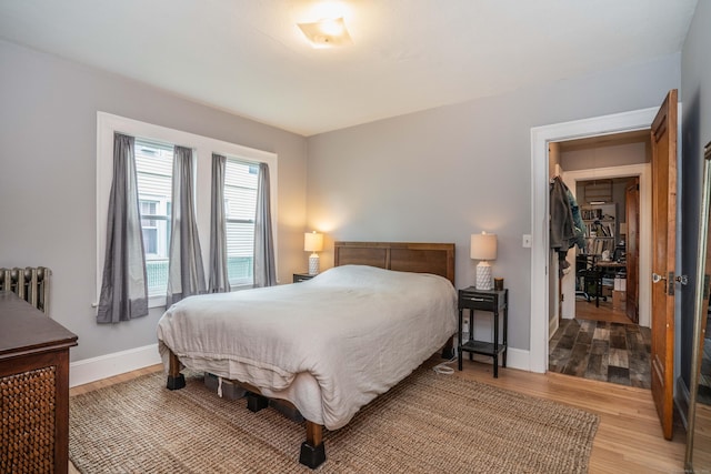 5 Seymour Ave, West Hartford, CT 06119 - bedroom with radiator heating unit, wood finished floors, and baseboards