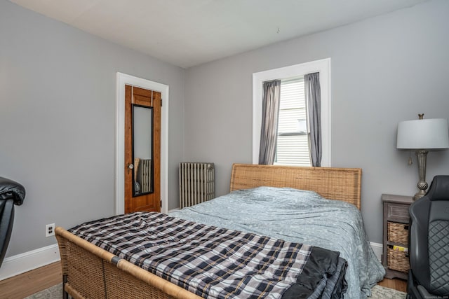 5 Seymour Ave, West Hartford, CT 06119 - bedroom featuring radiator, wood finished floors, and baseboards