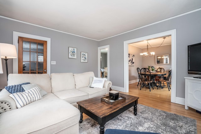 5 Seymour Ave, West Hartford, CT 06119 - living area featuring a chandelier, wood finished floors, crown molding, and baseboards