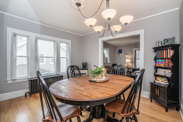5 Seymour Ave, West Hartford, CT 06119 - dining space featuring a chandelier, crown molding, baseboards, light wood-style floors, and radiator