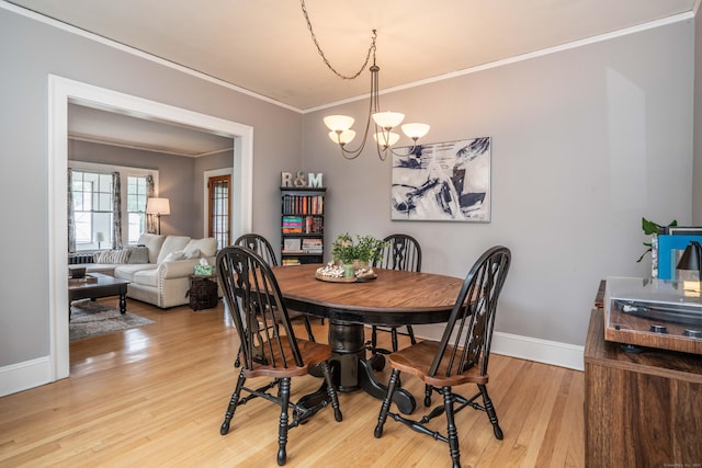 5 Seymour Ave, West Hartford, CT 06119 - dining room featuring crown molding, a chandelier, light wood finished floors, and baseboards