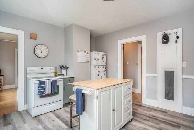 5 Seymour Ave, West Hartford, CT 06119 - kitchen featuring white appliances, light wood finished floors, a breakfast bar, and a desk