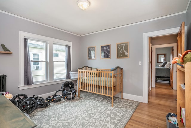 5 Seymour Ave, West Hartford, CT 06119 - bedroom featuring light wood finished floors, crown molding, and baseboards