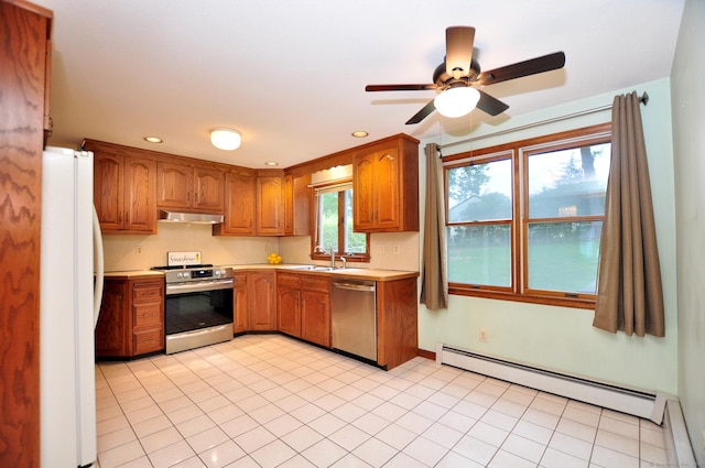 24 Jennifer Rd, Bristol, CT 06010 - kitchen with stainless steel appliances, under cabinet range hood, a baseboard heating unit, light countertops, and a ceiling fan