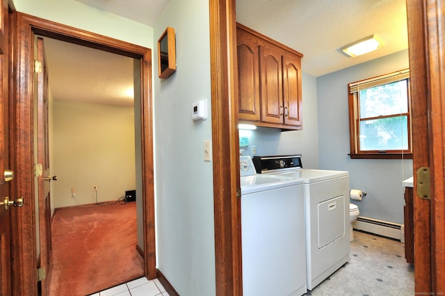 24 Jennifer Rd, Bristol, CT 06010 - laundry area featuring baseboard heating, cabinet space, independent washer and dryer, a textured ceiling, and light tile patterned floors