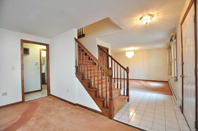 24 Jennifer Rd, Bristol, CT 06010 - stairway featuring a baseboard heating unit, carpet flooring, baseboards, and tile patterned flooring