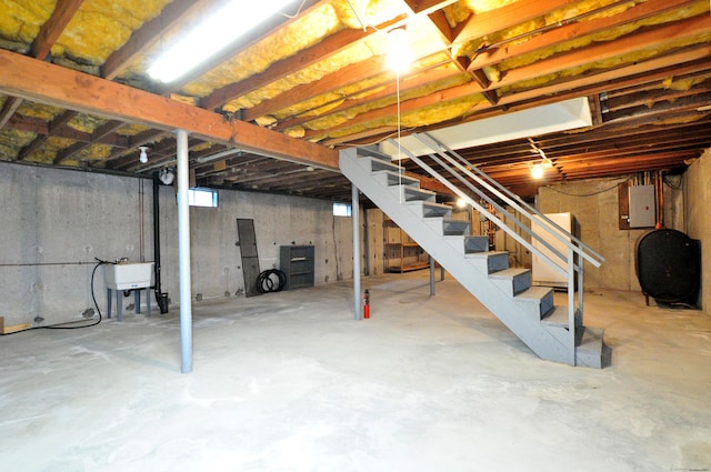 24 Jennifer Rd, Bristol, CT 06010 - basement with oil tank, electric panel, and stairway
