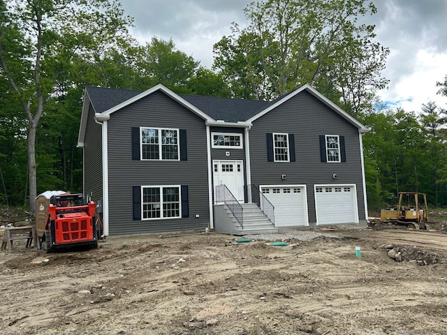 45 Logans Ln, Thompson, CT 06277 - split foyer home with an attached garage and view of scattered trees