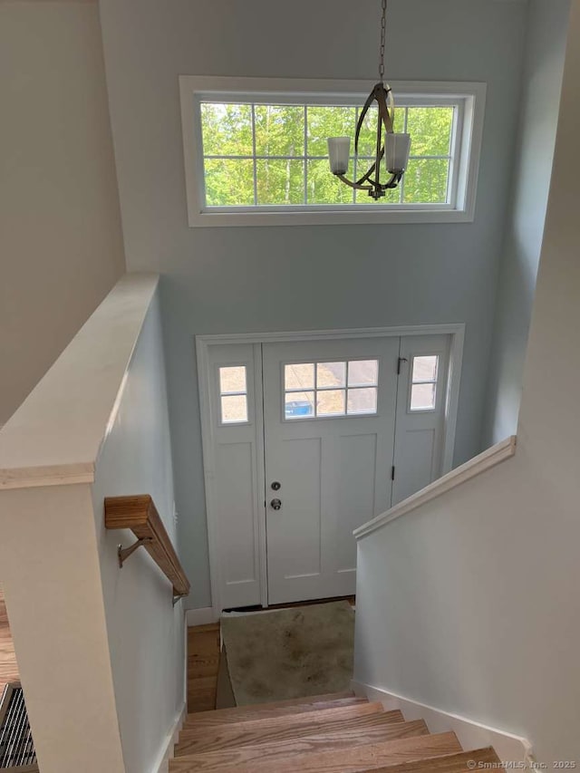 45 Logans Ln, Thompson, CT 06277 - entrance foyer featuring a chandelier, stairway, and wood finished floors