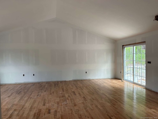 45 Logans Ln, Thompson, CT 06277 - unfurnished room featuring vaulted ceiling and wood finished floors