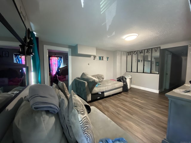 33 Oak St, Derby, CT 06418 - bedroom featuring wood finished floors, baseboards, and a textured ceiling