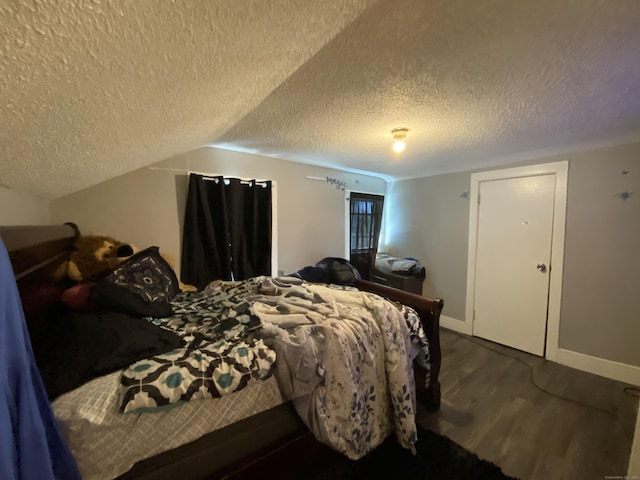 33 Oak St, Derby, CT 06418 - bedroom featuring wood finished floors, a textured ceiling, baseboards, and vaulted ceiling