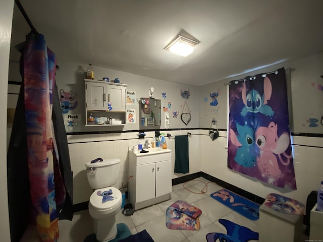 33 Oak St, Derby, CT 06418 - full bath featuring vanity, toilet, tile patterned flooring, curtained shower, and tile walls