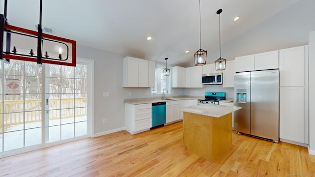 25 First Ave, Enfield, CT 06082 - kitchen with appliances with stainless steel finishes, a sink, white cabinets, a center island, and recessed lighting