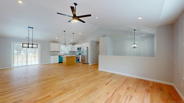 25 First Ave, Enfield, CT 06082 - unfurnished living room with a ceiling fan, lofted ceiling, light wood-style flooring, baseboards, and a sink