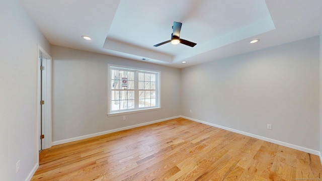 25 First Ave, Enfield, CT 06082 - empty room featuring recessed lighting, a ceiling fan, light wood-type flooring, a tray ceiling, and baseboards