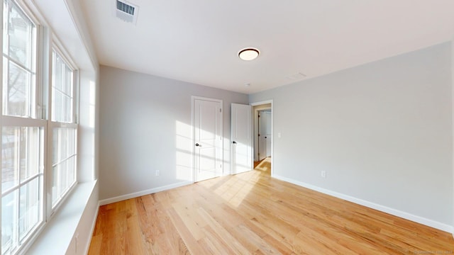 25 First Ave, Enfield, CT 06082 - spare room featuring healthy amount of natural light, light wood-style floors, and baseboards