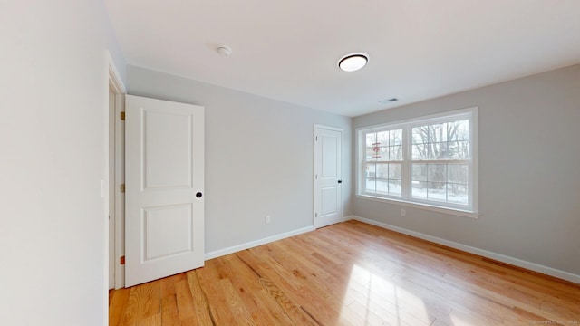 25 First Ave, Enfield, CT 06082 - unfurnished bedroom featuring light wood-style flooring and baseboards