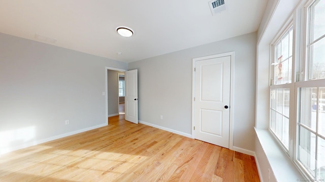 25 First Ave, Enfield, CT 06082 - unfurnished bedroom featuring baseboards and light wood-style flooring