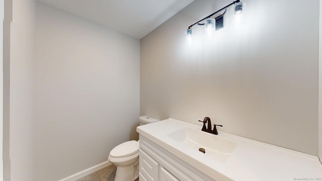 25 First Ave, Enfield, CT 06082 - half bathroom with toilet, vanity, baseboards, and tile patterned floors
