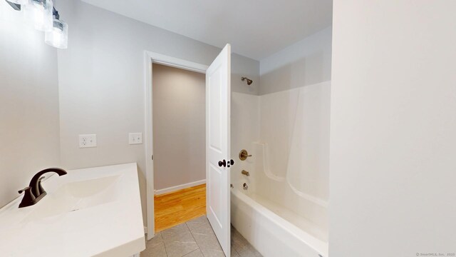 25 First Ave, Enfield, CT 06082 - bathroom featuring tile patterned flooring, shower / bathtub combination, and vanity