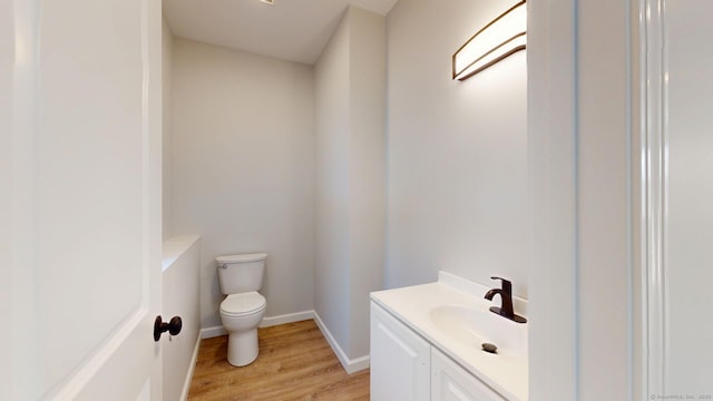 25 First Ave, Enfield, CT 06082 - bathroom with toilet, vanity, wood finished floors, and baseboards