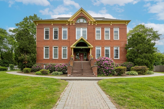 58 Woodley Ct Unit 14, Meriden, CT 06450 - view of front of home featuring a front lawn and brick siding