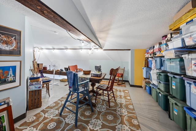58 Woodley Ct Unit 14, Meriden, CT 06450 - dining area featuring a textured ceiling, baseboards, and rail lighting