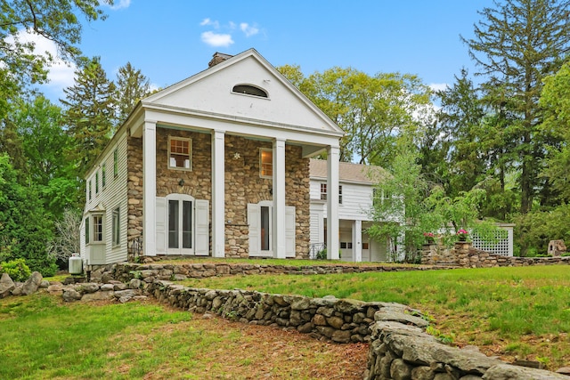 16 Katydid Ln, Weston, CT 06883 - greek revival inspired property with stone siding and a front lawn