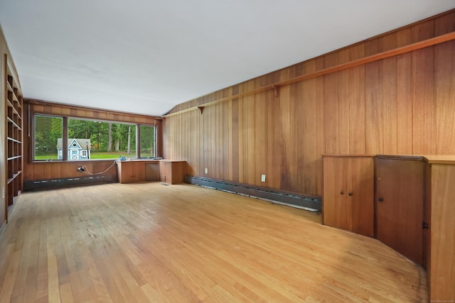 16 Katydid Ln, Weston, CT 06883 - empty room with a baseboard radiator, light wood-style floors, and wooden walls