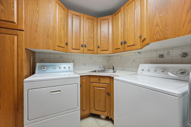 16 Katydid Ln, Weston, CT 06883 - laundry room featuring washer and clothes dryer, cabinet space, and light tile patterned floors