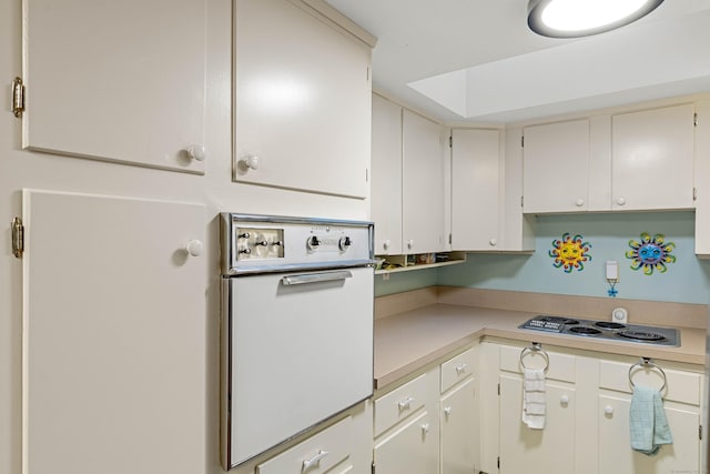 332 Shewville Rd, Ledyard, CT 06339 - kitchen with white oven, light countertops, and electric cooktop