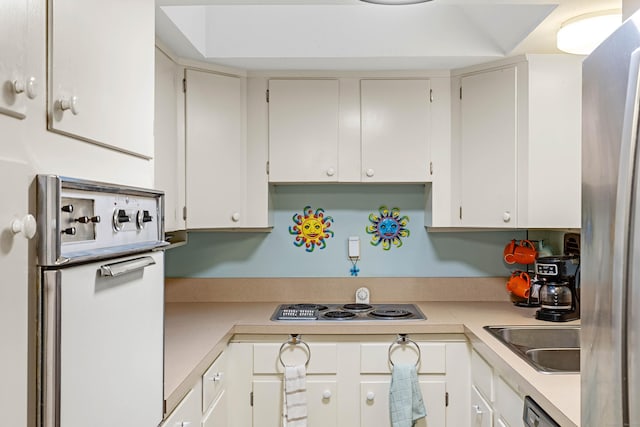 332 Shewville Rd, Ledyard, CT 06339 - kitchen featuring appliances with stainless steel finishes, light countertops, a sink, and white cabinets