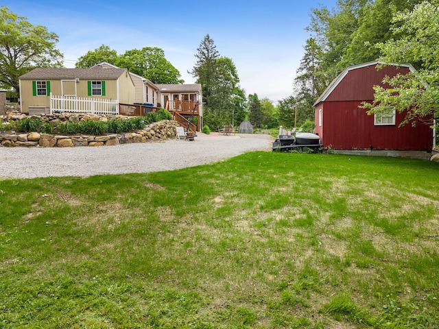 332 Shewville Rd, Ledyard, CT 06339 - view of grassy yard with an outdoor structure and a deck