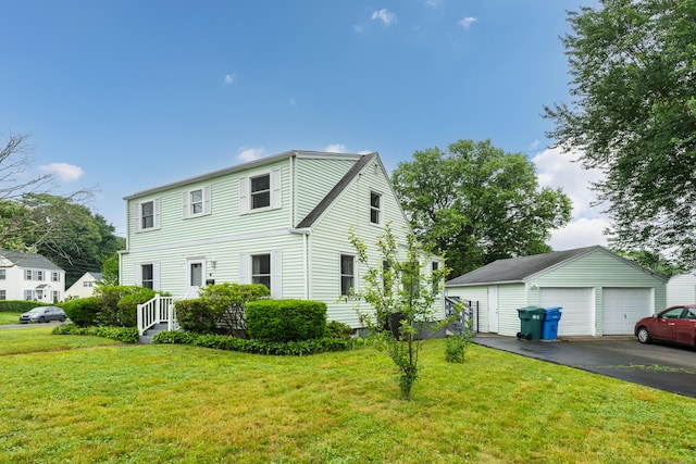 21 Pond Rd, Hamden, CT 06514 - view of front of property with a garage, an outbuilding, and a front yard